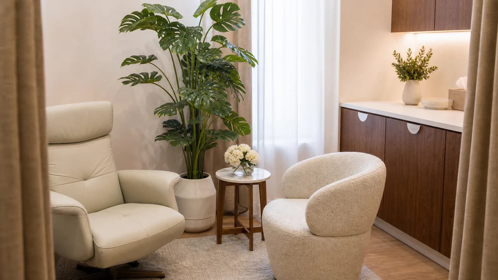 Private consultation room at Her Health and Aesthetics with two patient chairs